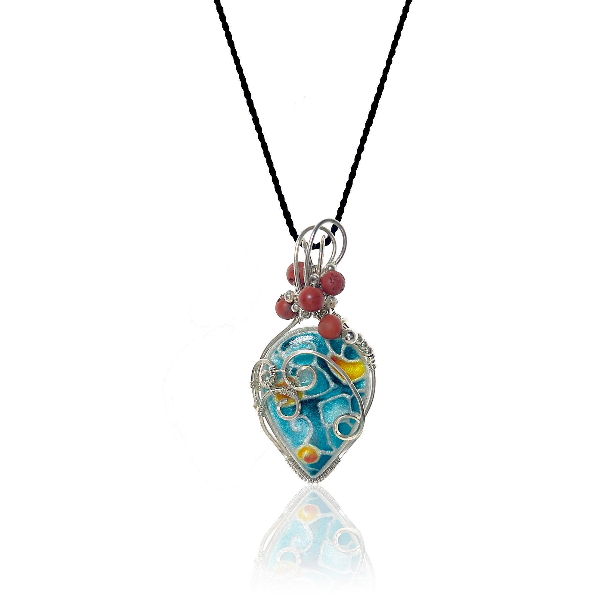 Drop-shaped pendant with original handcrafted stone painted in turquoise, yellow, and orange' sterling silver scrollwork, matte red jasper beads with silver and glass beads at the top, hung from a silk cord.