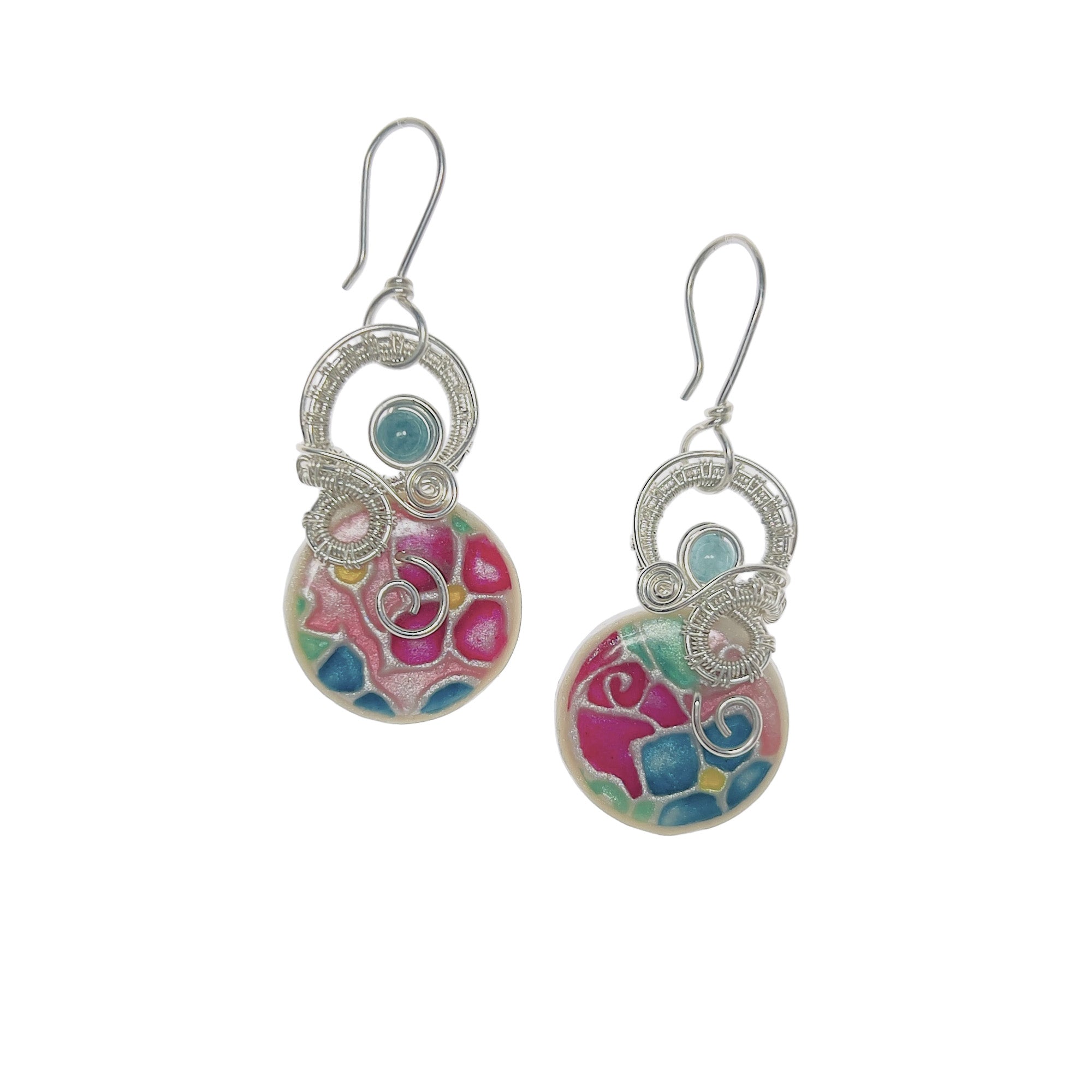 Drop earrings with sculpted sterling silver loops arching over a circular stone in shades of pink, magenta, teal blue, and mint green, curving down and along the top edge, finished with a serpentine aquamarine bead and a silver spiral accent.