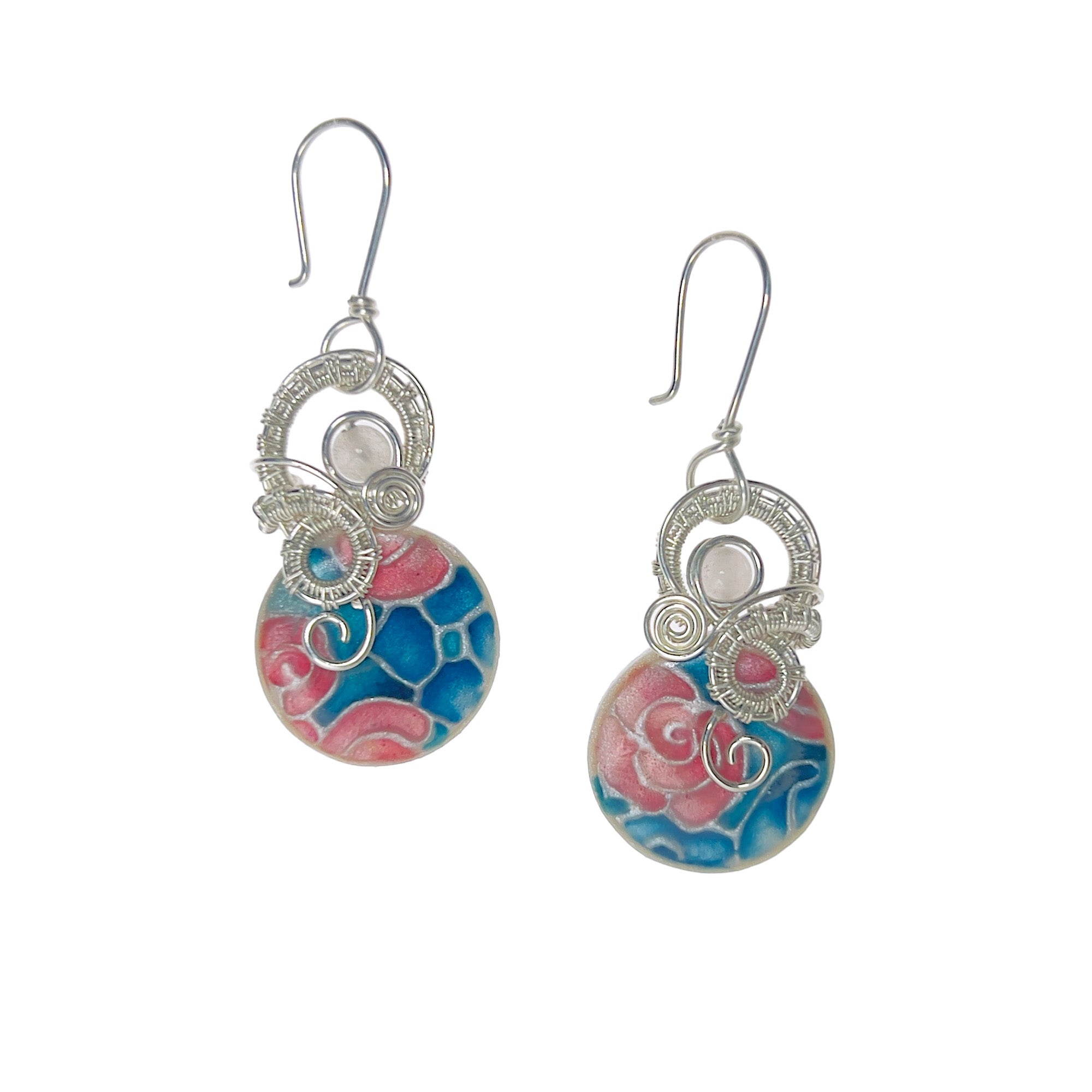 Dangle earrings featuring sterling silver loops, a pink rose quartz accent, and a floral pattern in blue, pink, and teal.