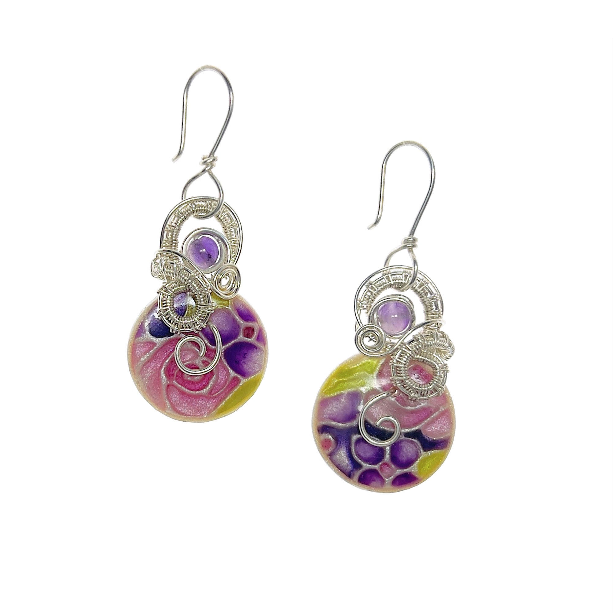 Drop earrings with sculpted sterling silver loops arching over a circular stone in shades of purple, pink, and peridot green, curving down and along the top edge, finished with an amethyst bead and a silver spiral accent.
