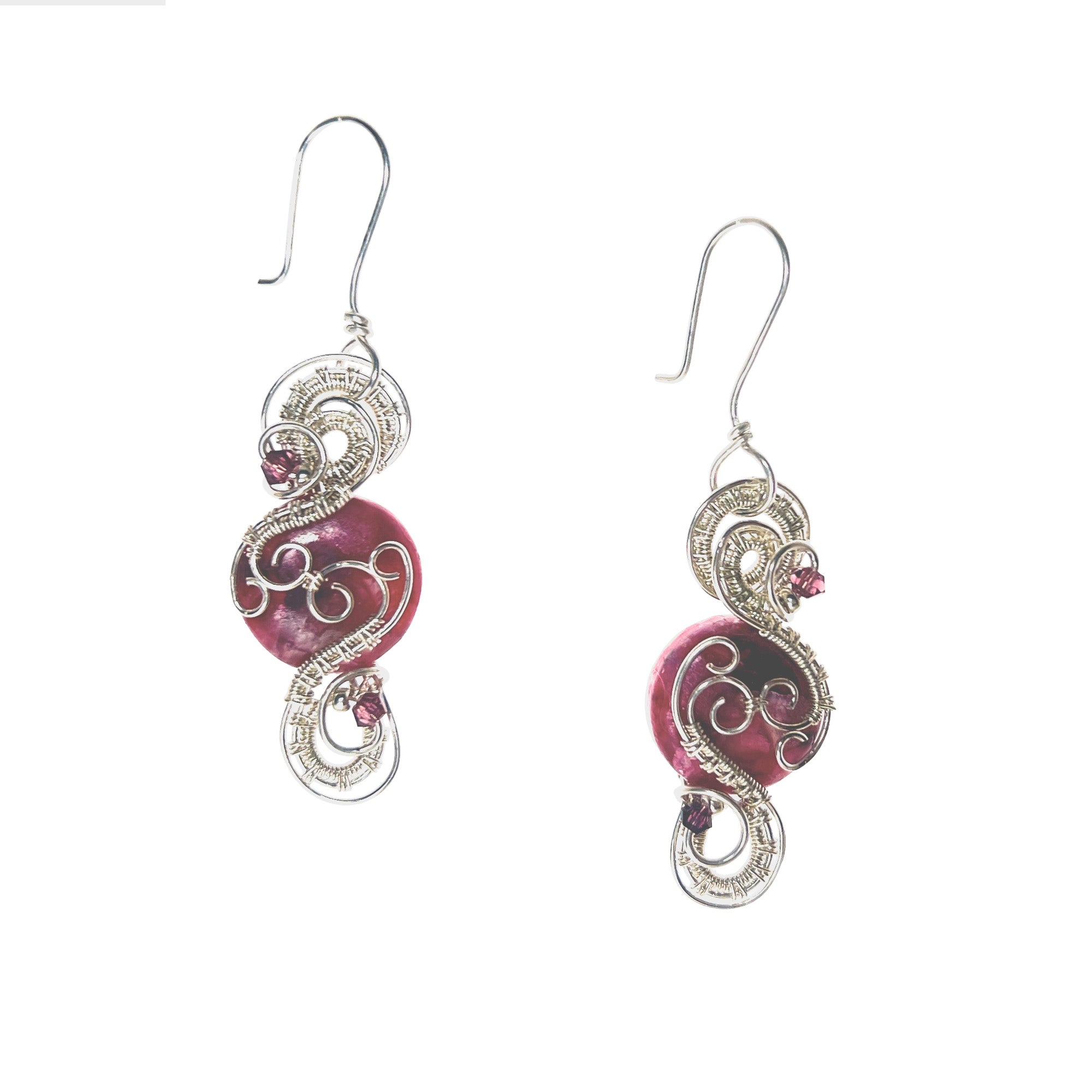 Round earrings featuring a pink stone with continuous interlaced sterling silver details framing its top and bottom, accented by two pink Austrian crystals.