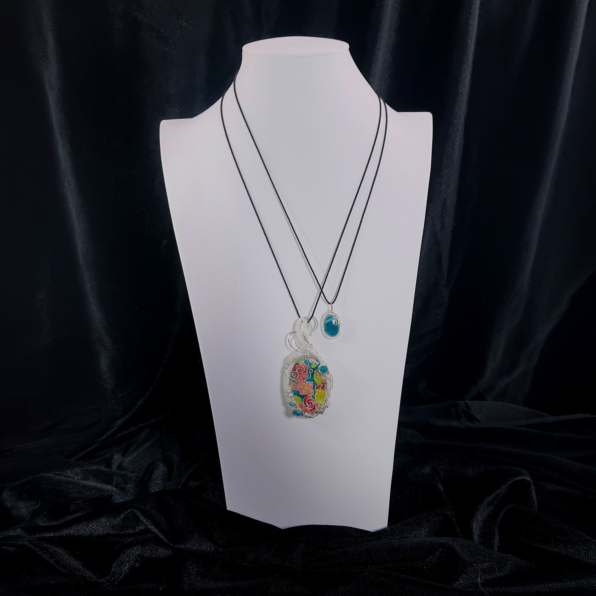Triad Pendant Set displayed on a bust to show scale.